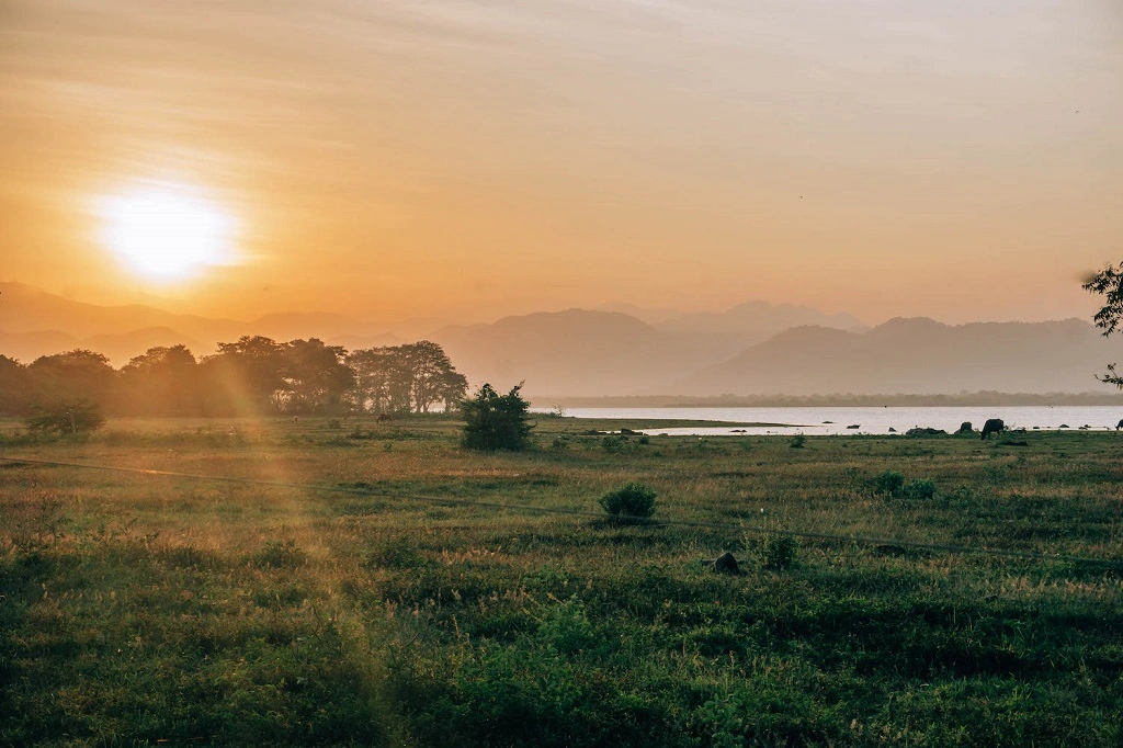 Stunning sunset reflecting over Udawalawe Reservoir in Sri Lanka